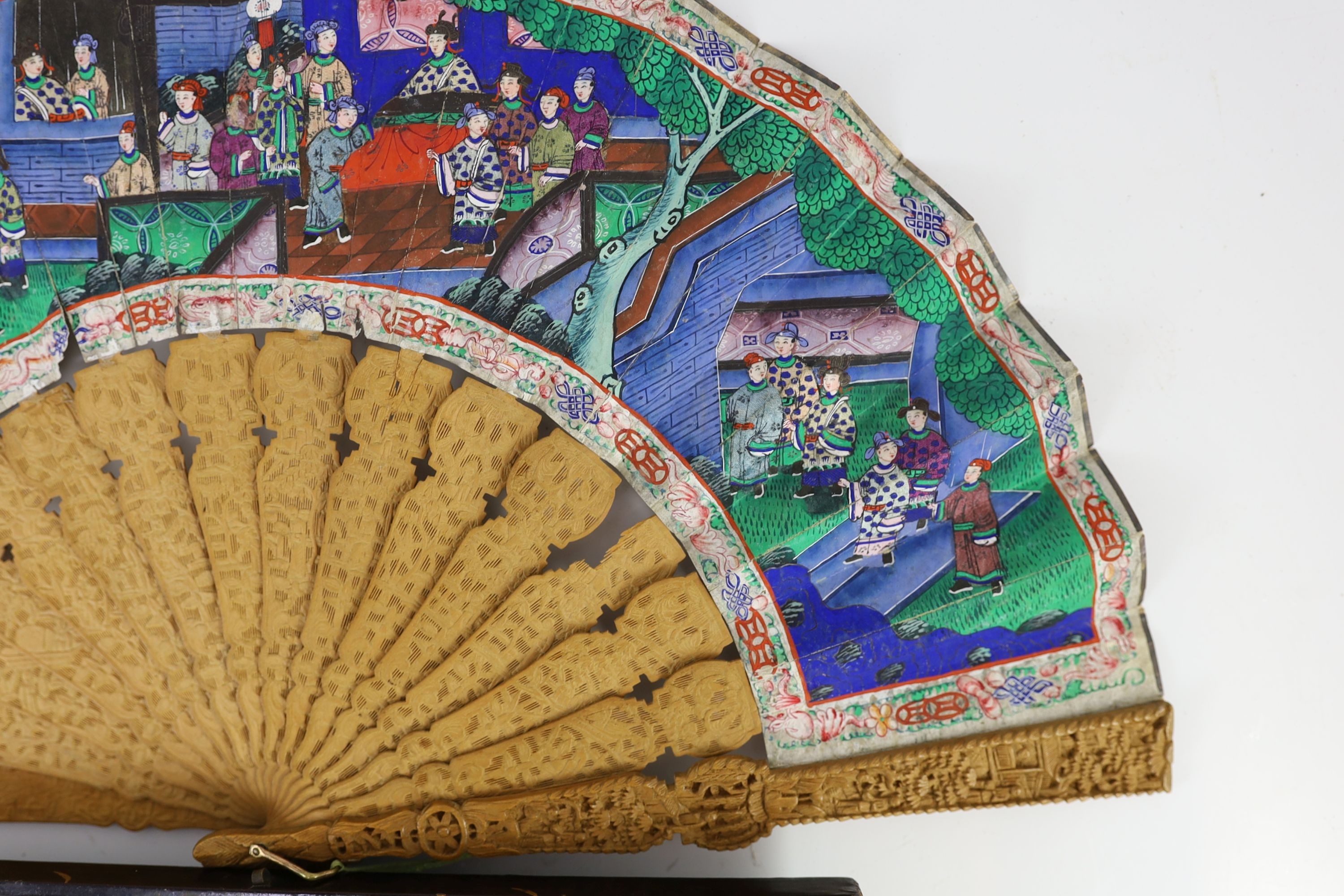 A Chinese lacquer cased sandalwood and lacquer fan, 19th century, 32cm, slight damage